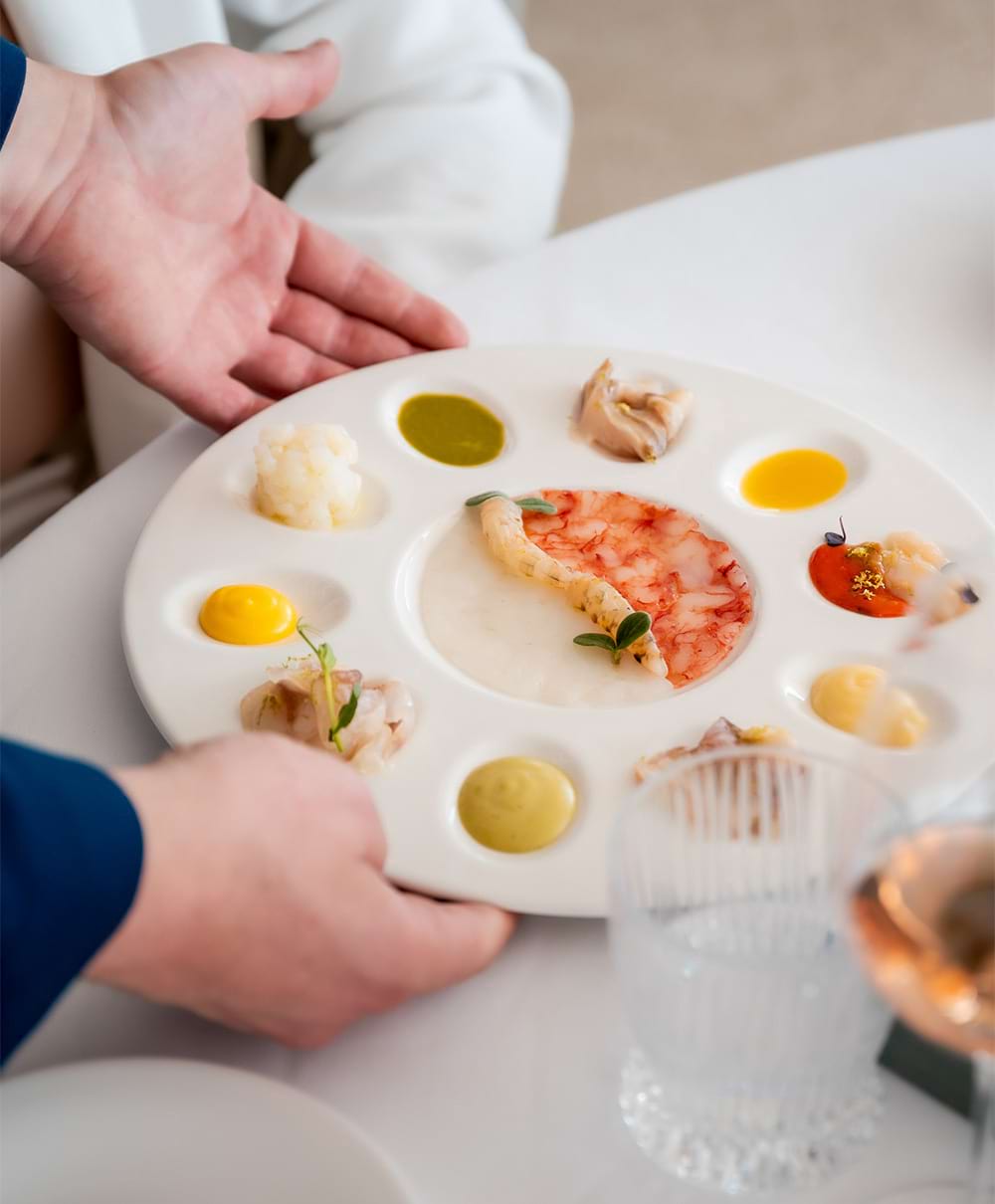 Piatti gourmet di pesce fresco nel ristorante Amarmio a Jesolo